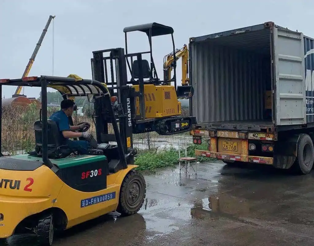 HHIXEN digger loading in container